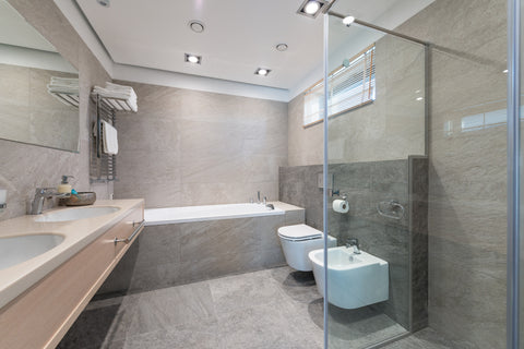 a modern bathroom with sinks and bidet