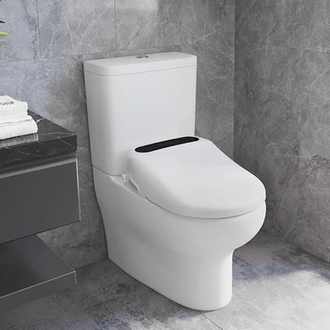 a smart toilet seat inside a grey tiled bathroom