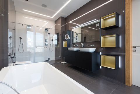 Interior of spacious master bathroom with bathtub and shower cabin