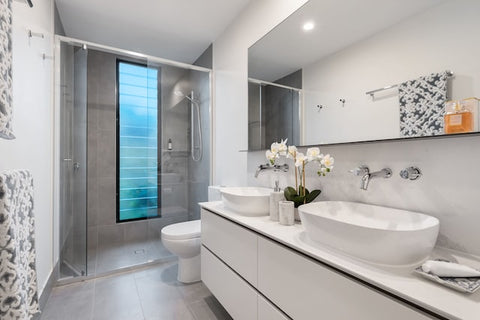 Large ensuite bathroom with his and hers basins, and large walk in shower.