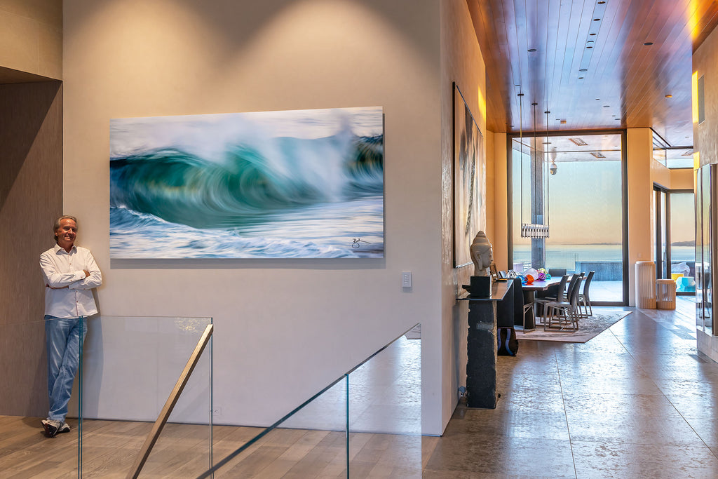 Breck Rothage with his 716am  Fine Artwork on the wall at The Strand in Dana Point.