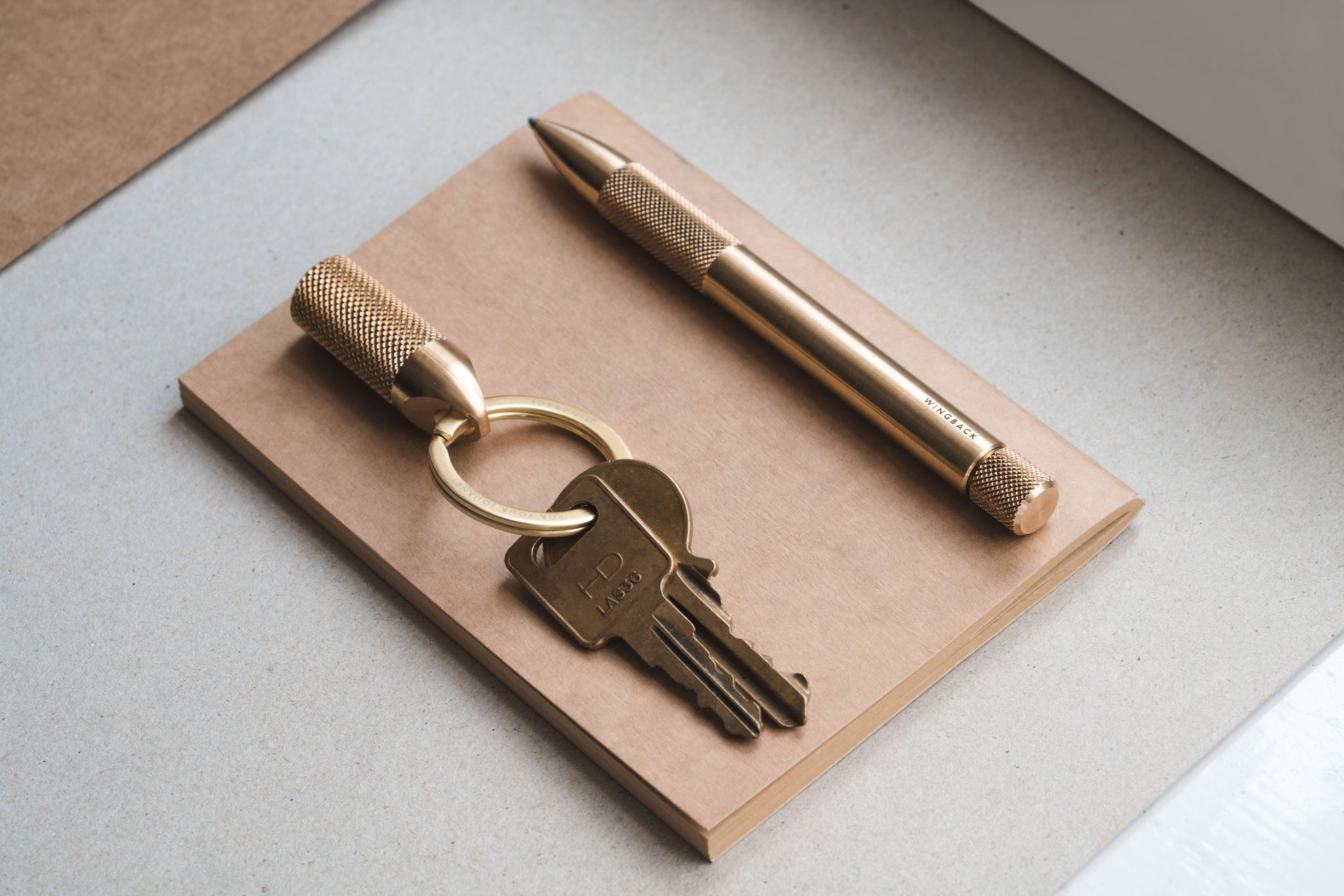 Buy less, buy better - machined brass stationery and key carry from Wingback