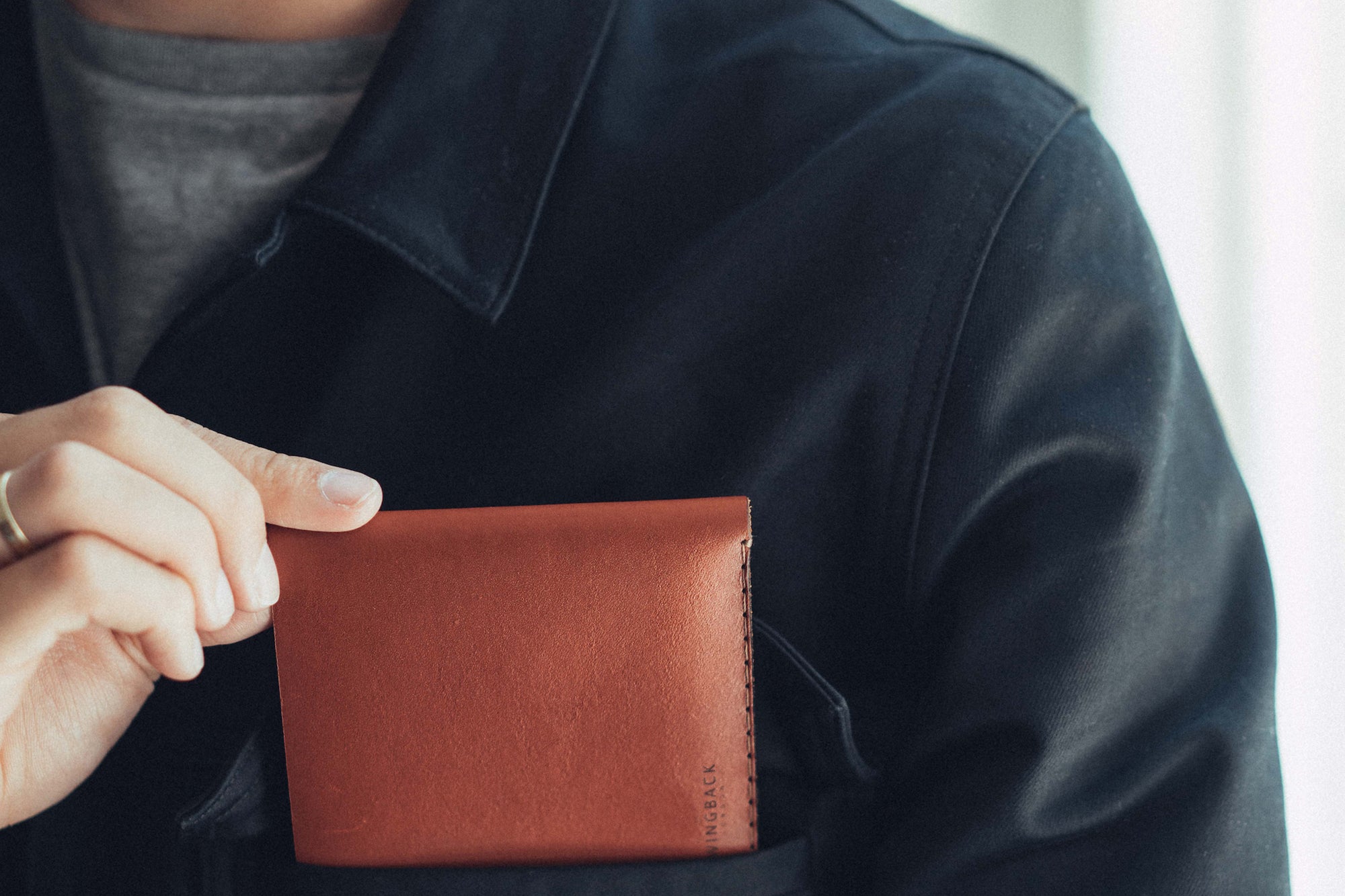 Personalised leather travel wallet in cognac by Wingback