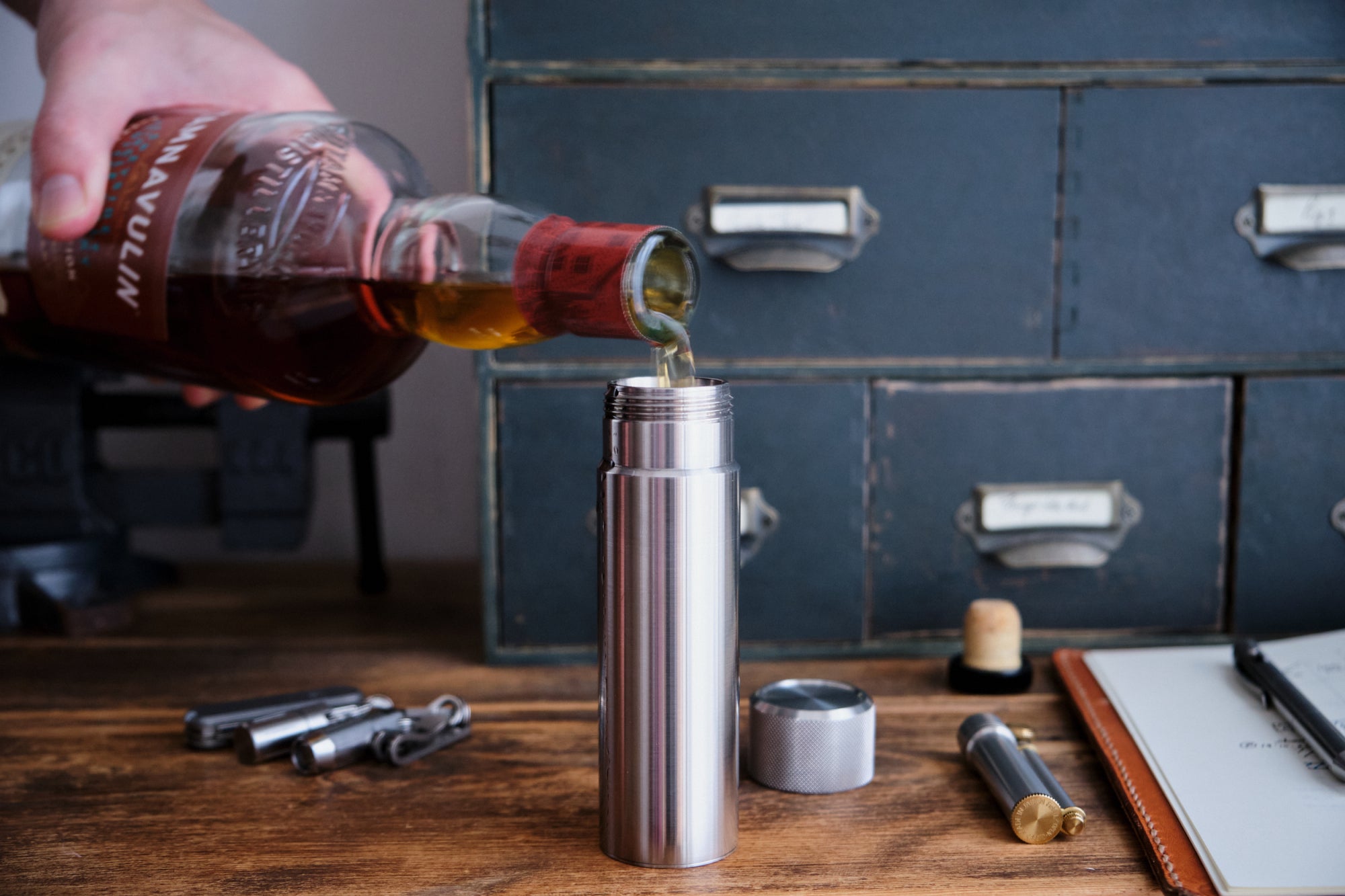 Pouring whisky into the 100ml Hip Flask - the perfect travel companion