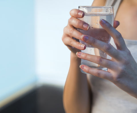 Drink plenty of water to manage sun-damaged skin