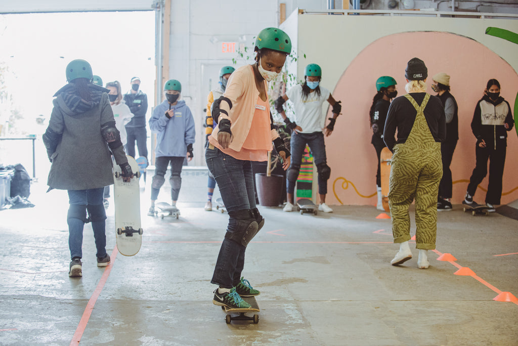 The Colour the Trails organization leads a skateboarding class