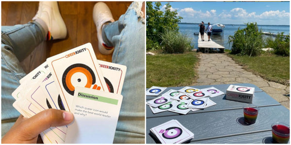 Split photo with an image of a Black hand holding a deck of Queeriosity cards on the left and a photo of a waterfront property on the right with Queeriosity game and drinks on a picnic table and a queer couple holding hands on the dock in the background