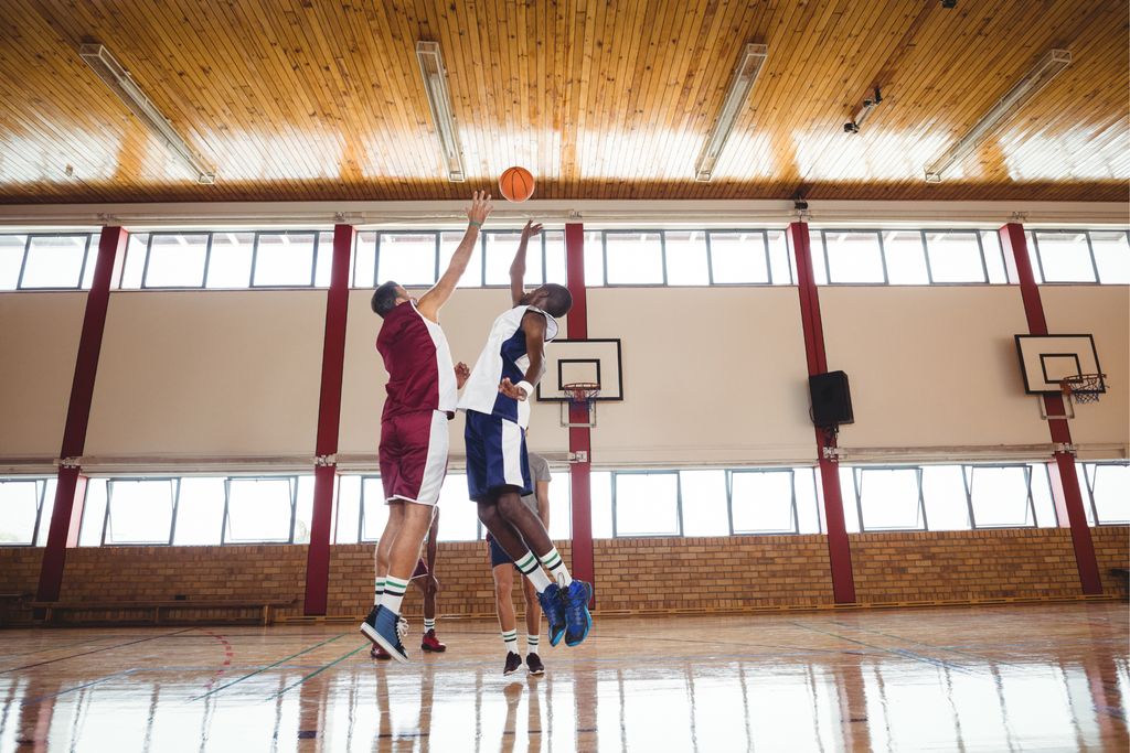 Two basketball players jumping