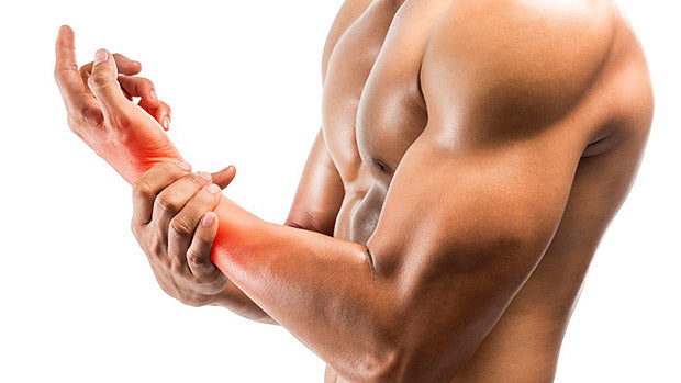 man holds his forearm following inflammation