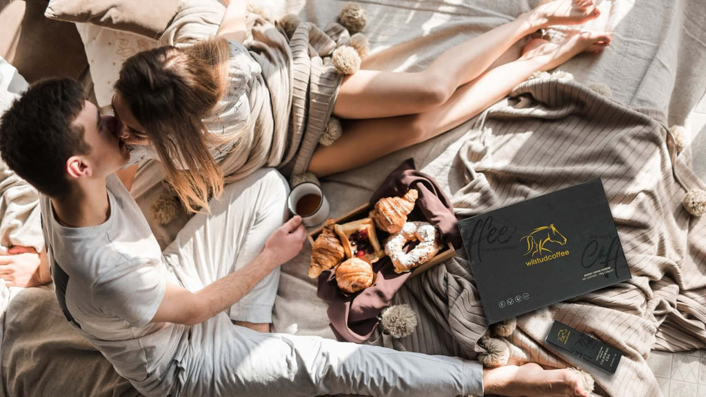 Couple drinking WildStud Maca Energy Coffee in bed 