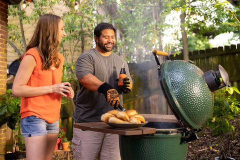 2 people enjoying grilling on their Big Green Egg