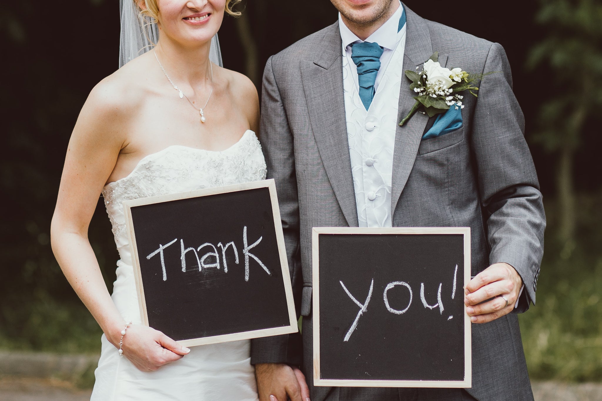 A wedding couple saying thank you