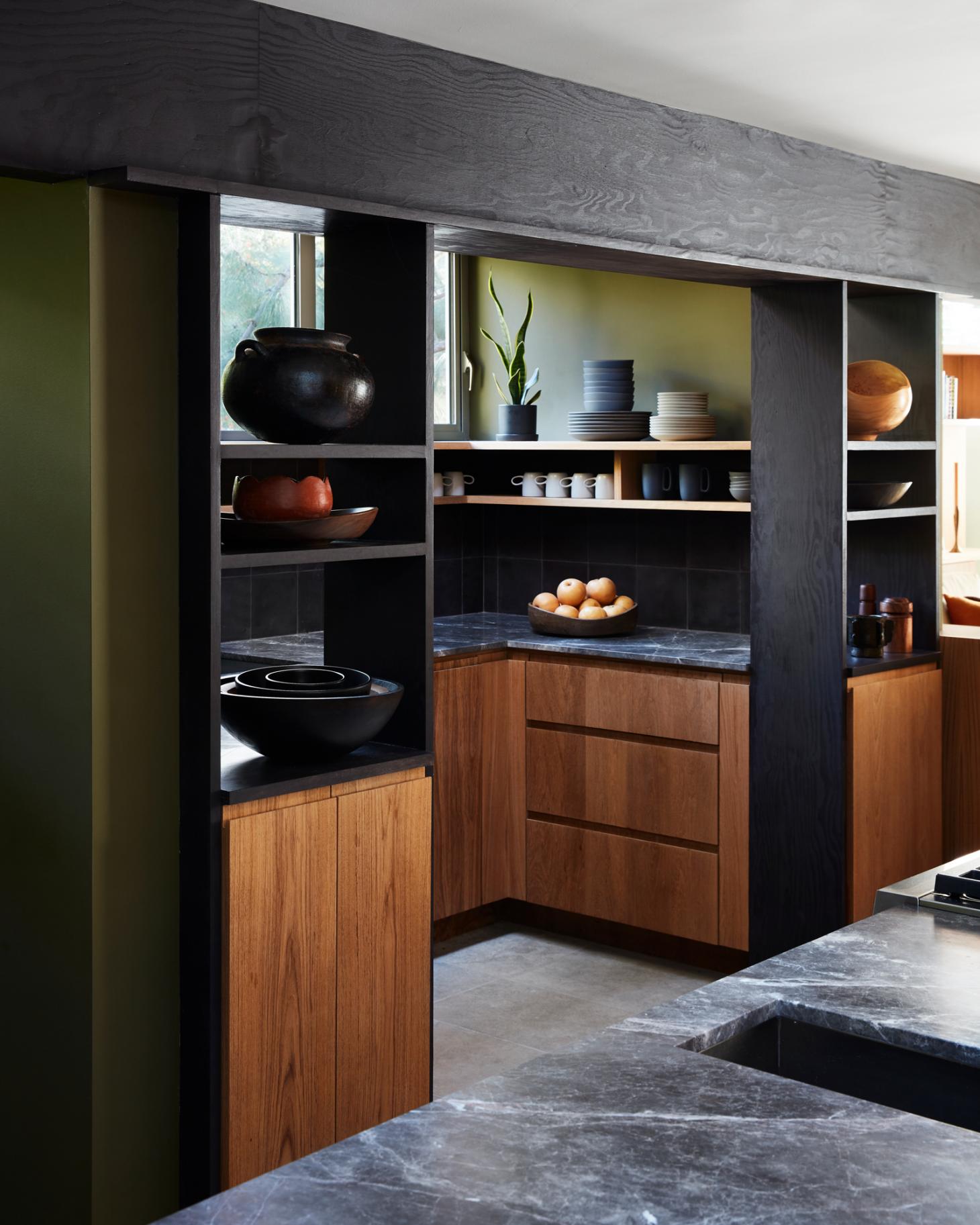 Dark Earth Tones in Hollywood Hills Kitchen by Studio Shamshiri