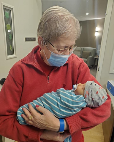 Alzheimers's patient with dementia from a nursing home holding a reborn baby doll.