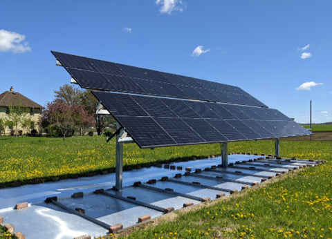 Bifacial panel array with reflection