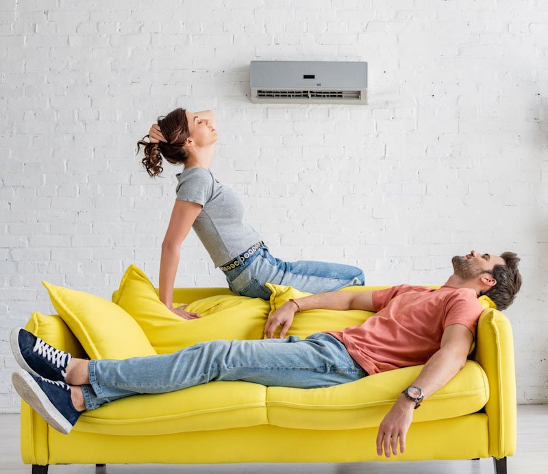 YOUNG-MAN-AND-WOMAN-ENJOYING-COOL-AIR