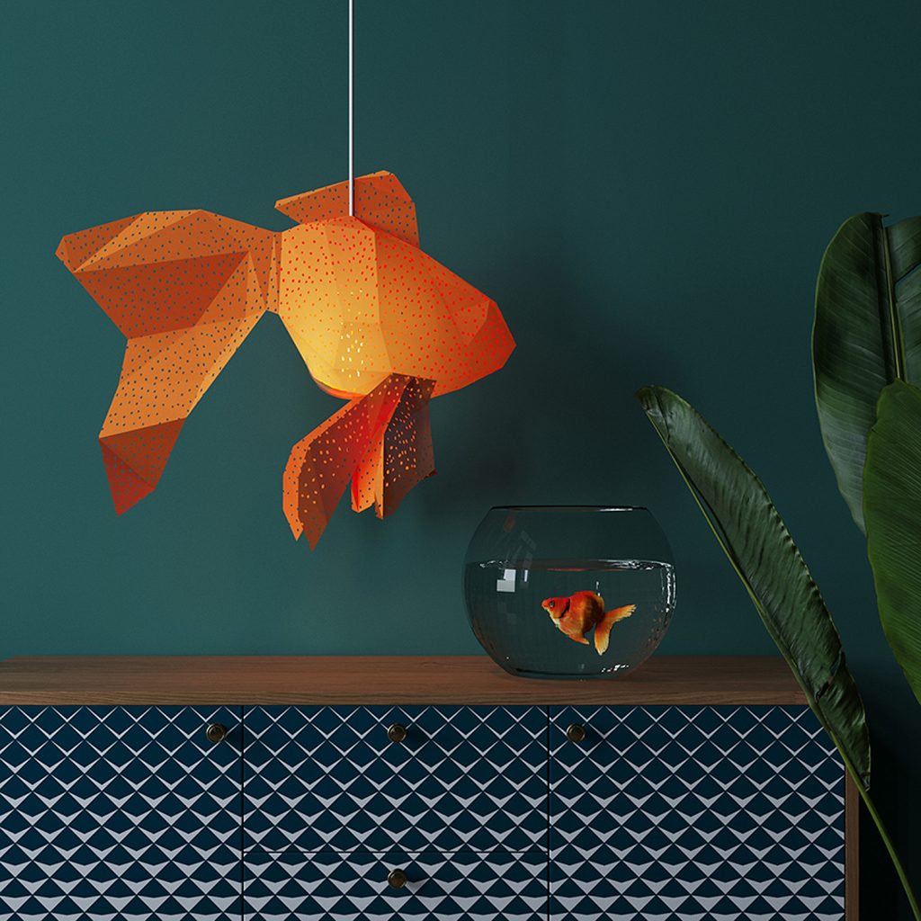 Goldfish lamp above goldfish bowl