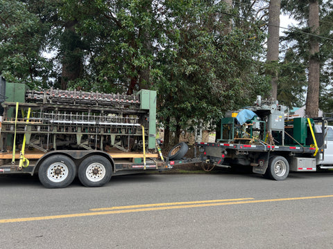 Mill equipment sitting on moving trucks