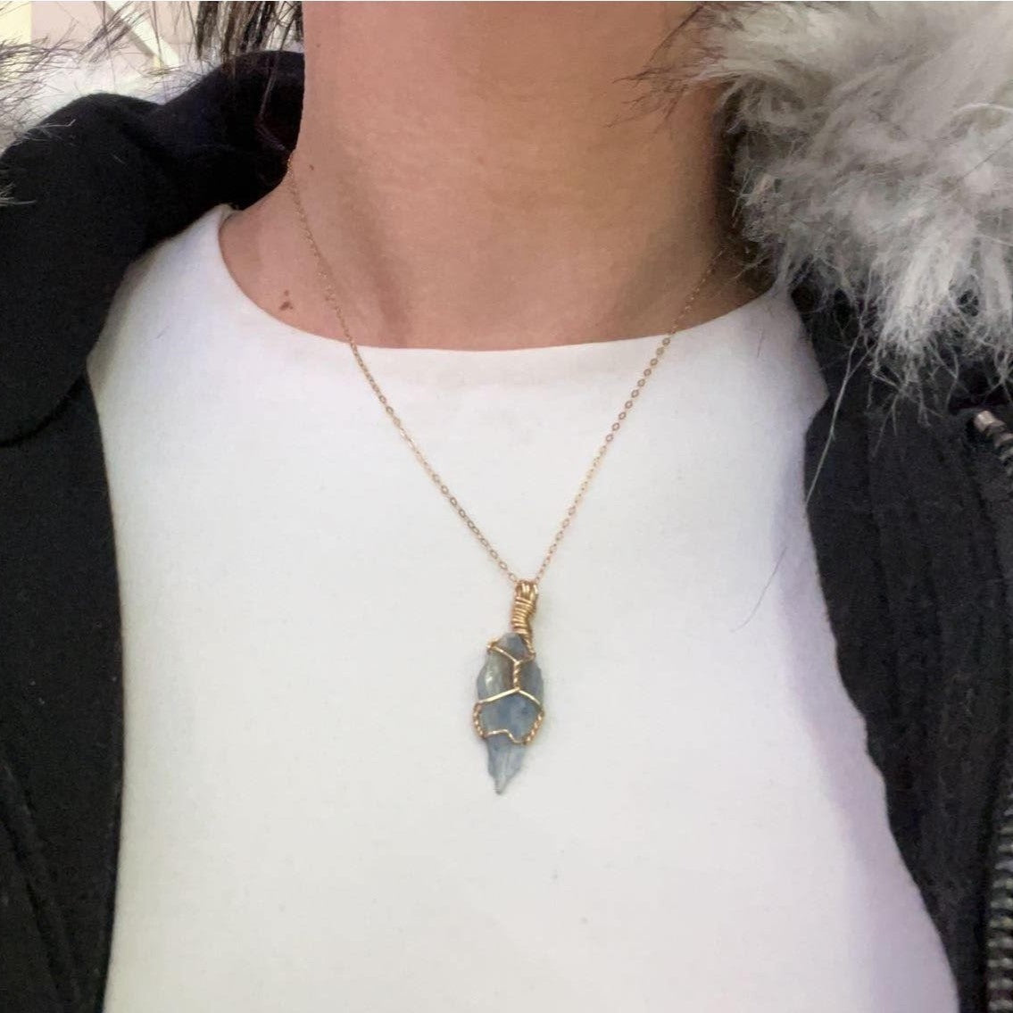 blue kyanite crystal necklace meaning in crystal jewelry. 