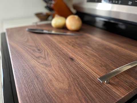 Wooden noodle board giving extra counter space in kitchen