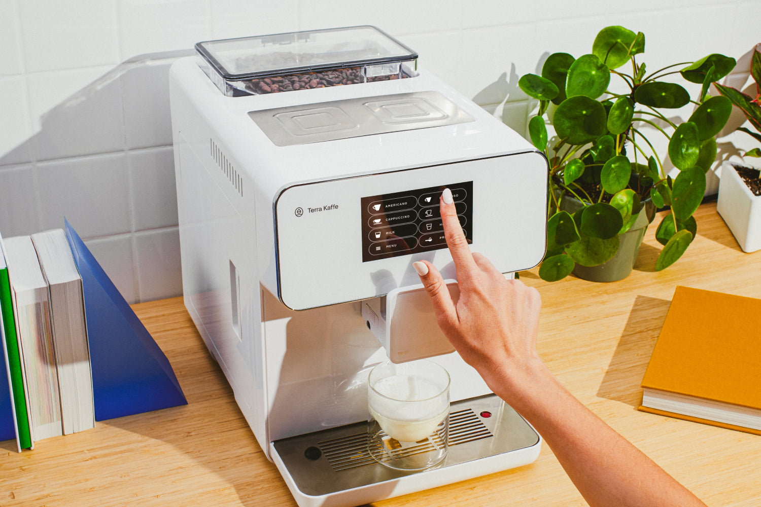 Person pressing cappucino on TK-01