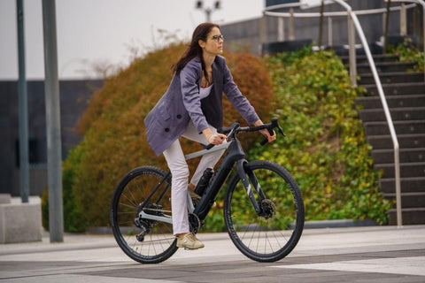 woman riding on a bike in the city