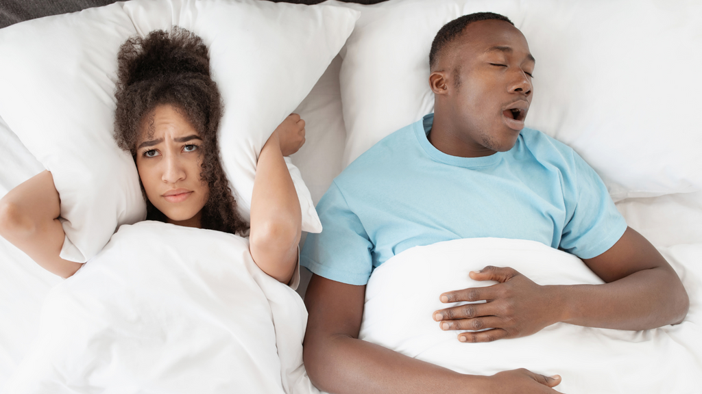 A person having difficulty sleeping, wondering if sleep apnea and overweight may be related.