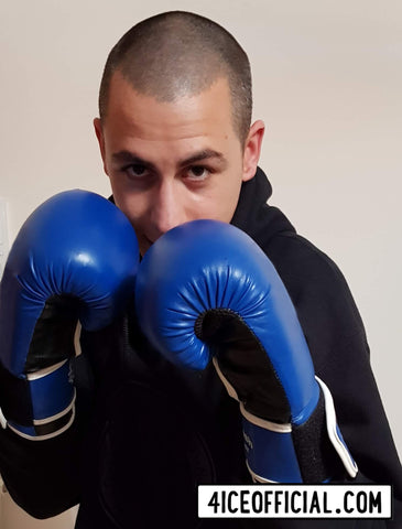 Marco Quattrocchi, creator and founder of 4iCe Elite Boxing Apparel wearing boxing gloves