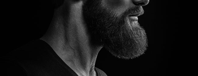 Close crop of a man's beard in black and white