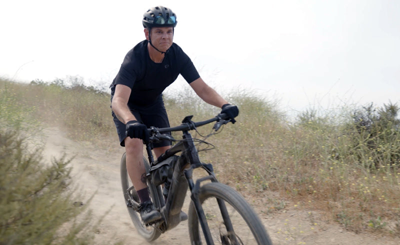 Rider riding the trail on a bicycle.