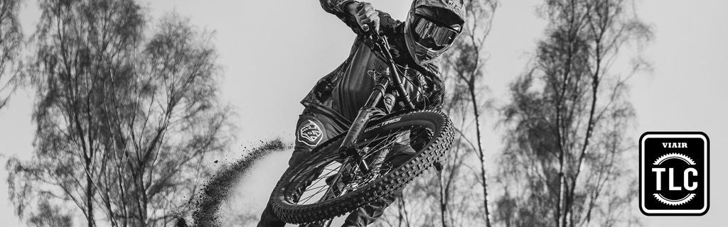 BMX Rider jumping a bike with safety gear on.