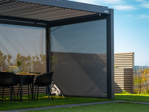 Pergola zip-screens lowered in wind for shelter