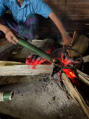 roasting the special bamboo for khalap