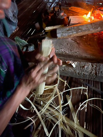 shaping a cap so the bamboo filled tea is airtight