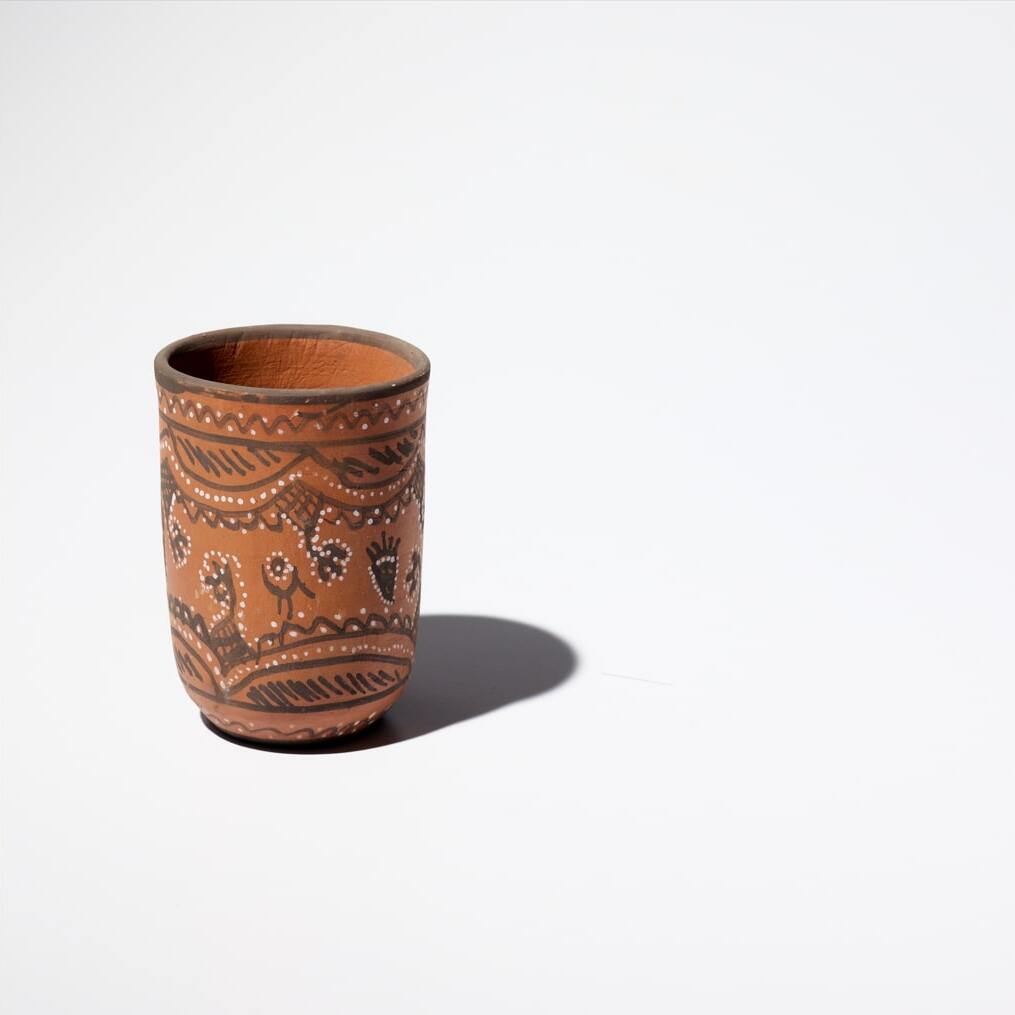 a rustic terracotta kulhad cup, an Indian style chai mug, traditionally used to serve a hot cup of chai