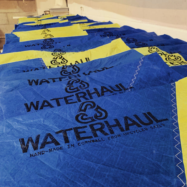 Waterhaul using old sails for clean-up bags