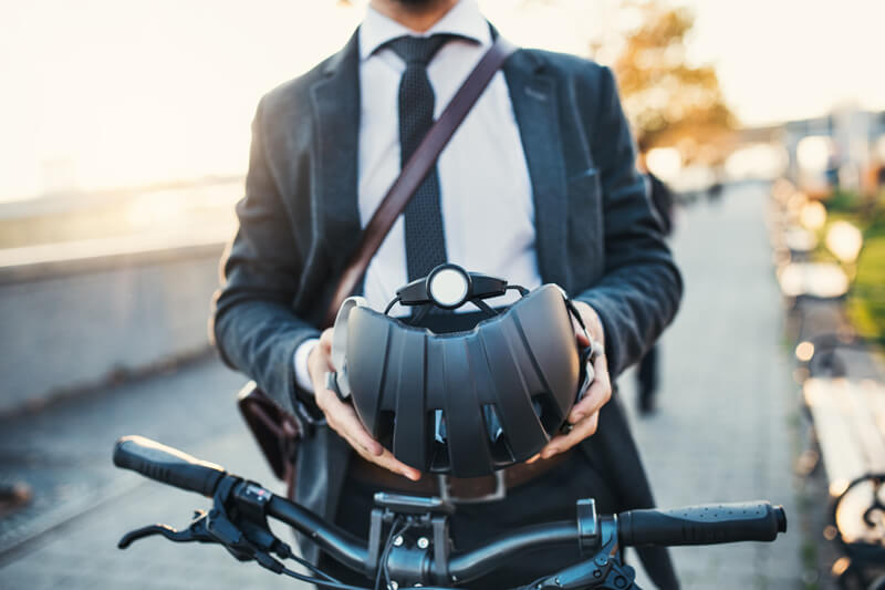 a man holds an e-bike helmet