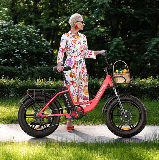 a lady standing next to a fast electric bike - engwe l20