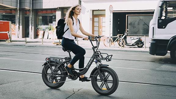 a woman rides a ladies' electric bike - engwe l20