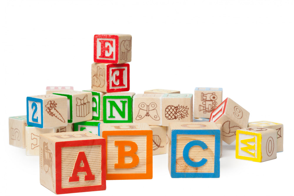 Quality alphabet wooden blocks with drawings of animals and fruits on all sides of the blocks
