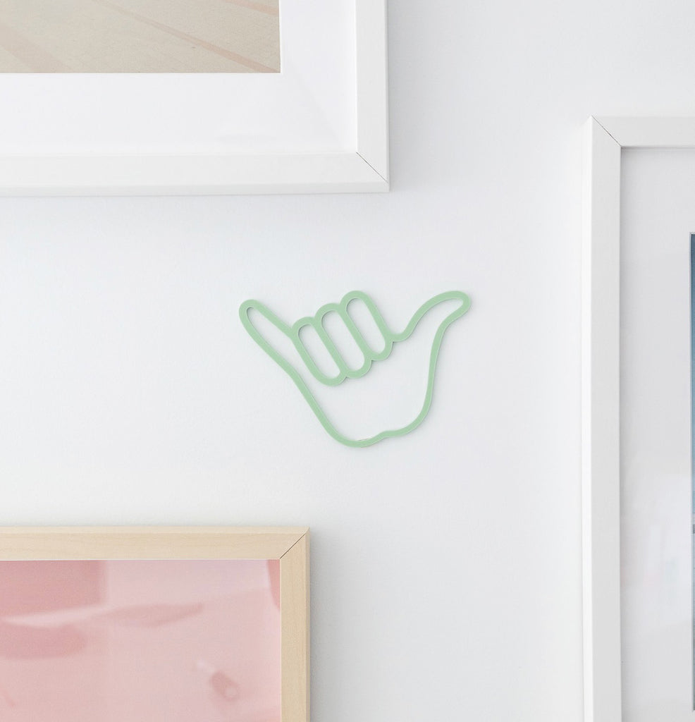 Green shaka hand sign wall decor