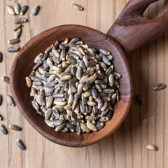 Milk Thistle Seeds in wodden bowl.