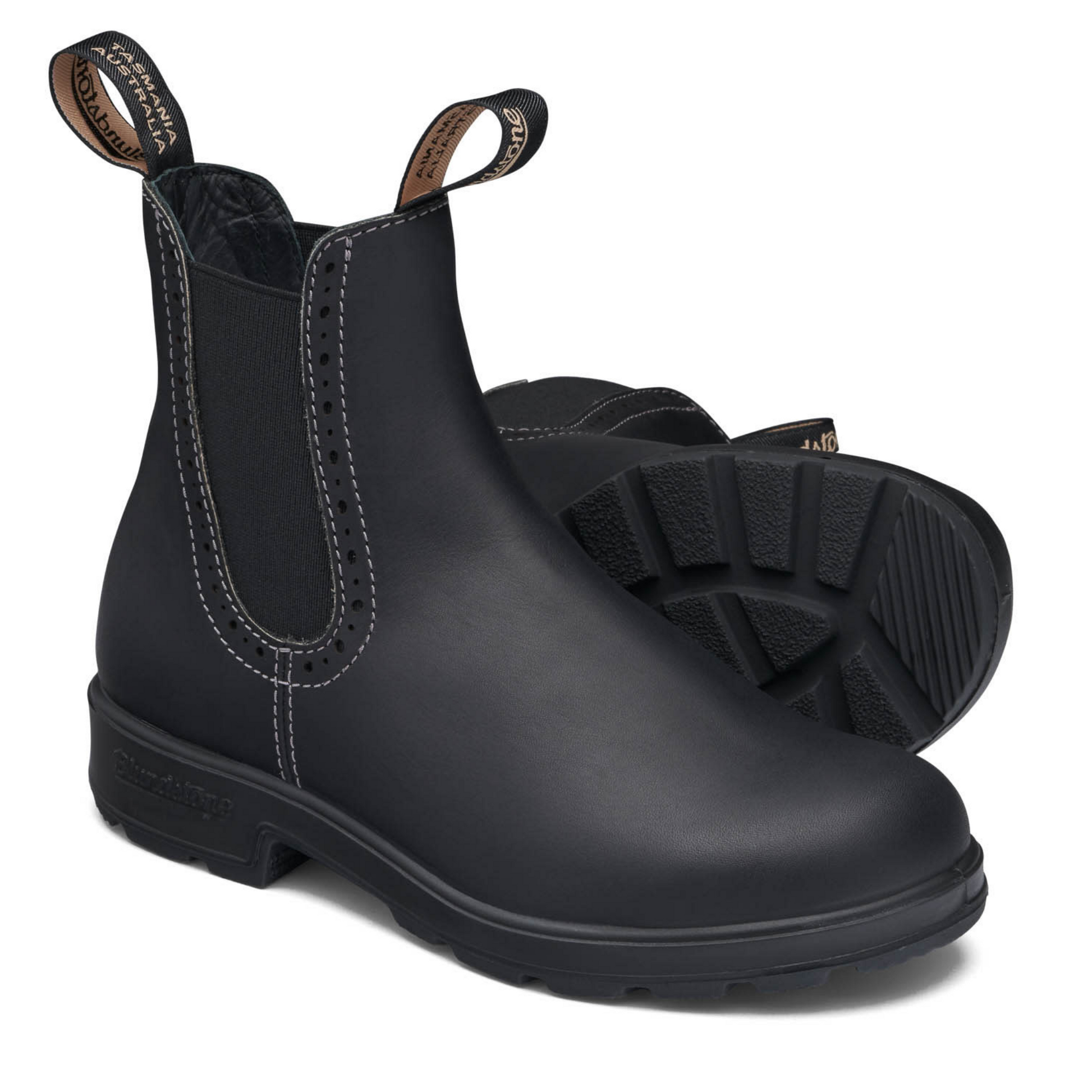 A pair of women's black boots with white stitching and a black sole.