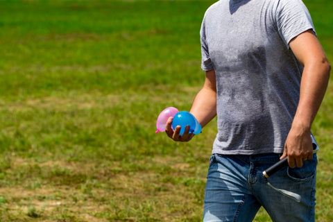 colorful-water-bombs-summer-ready-play-holding-balloons-hand