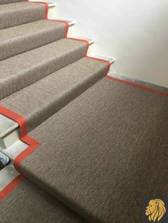 A boucle loop stair carpet runner with orange border