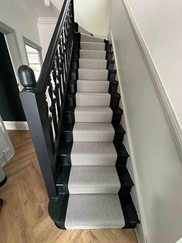 Black and white carpet stair runner