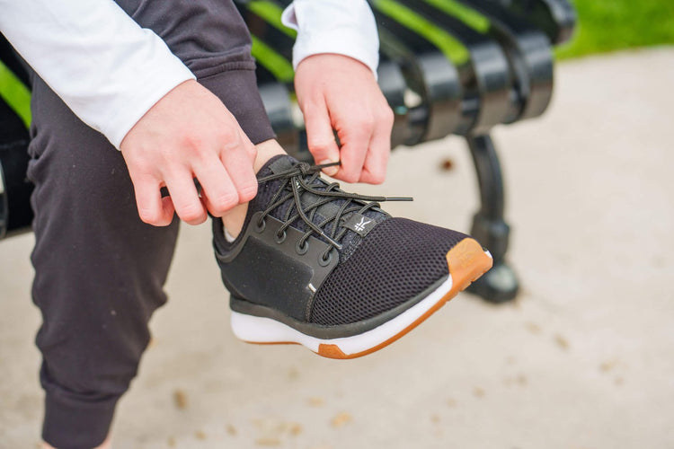 Woman wearing KURU ATOM stylish medium width shoes.