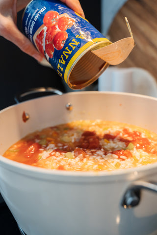 Delicious seafood risotto made with tomatoes, just like how the Italians do.