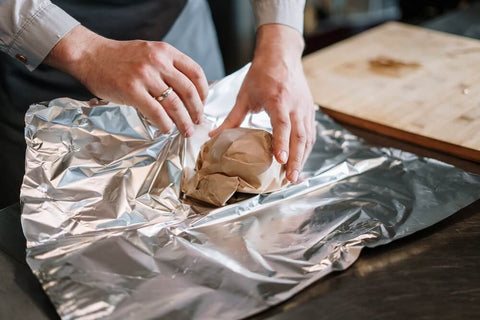 Aluminum foil used to store food. Photo by cottonbro studio.