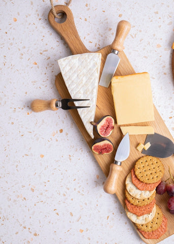 A cheeseboard is a fun dish to serve friends and maybe even the new neighbor at their first housewarming party! Photo by Georgie Devlin.